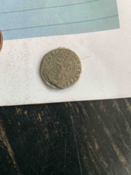 Unable to definitively identify; appears to be an ancient or medieval hammered coin
