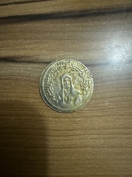 Likely a coin from a Persian or Islamic dynasty; potentially a 'Shahi' or similar denomination, though specific identification without clear inscriptions is difficult.
