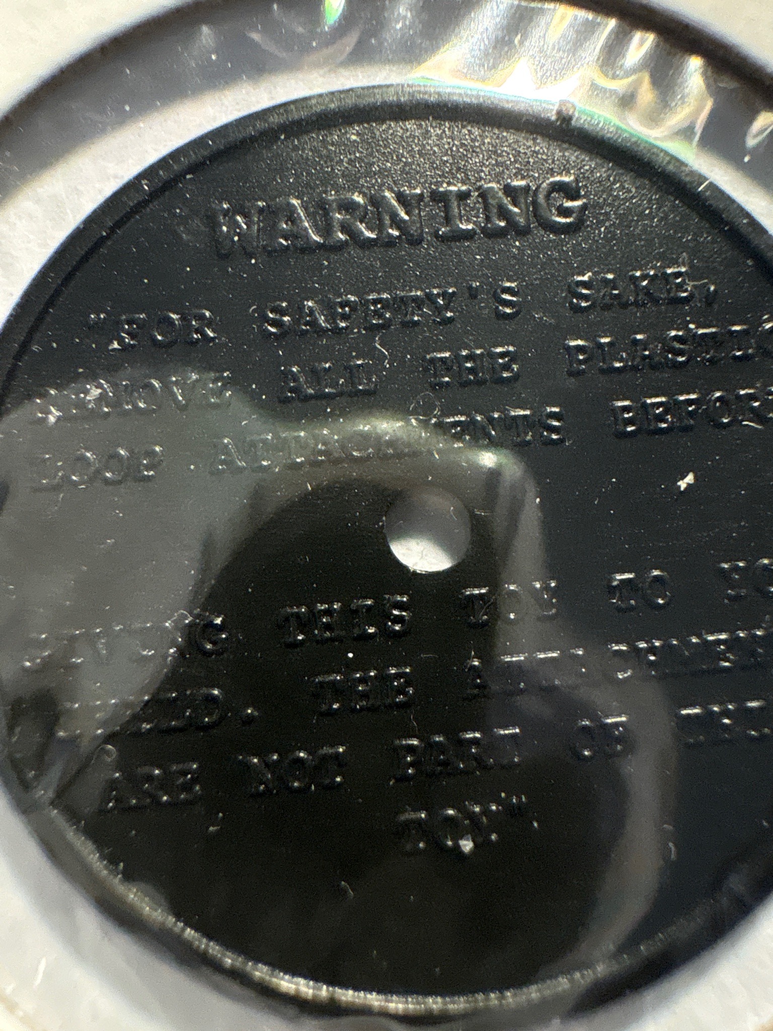 Toy Packaging Fastener / Plastic Retainer Disc — reverse